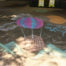 Chalk drawing of hot air balloon with "the sky's the limit" text.