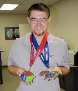 Daniel with his Spartan Race medals