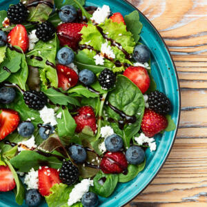 Berries salad (blueberry strawberry blackberry ) with cheese feta and balsamic sauce